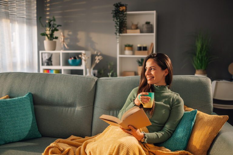 Woman relaxing on the couch while she waits for her IVF ultrasound appointment